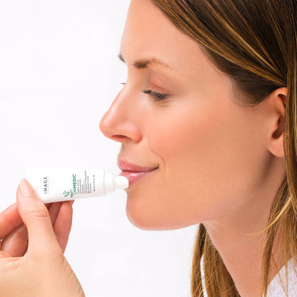 Woman using ORMEDIC lip enhancement complex